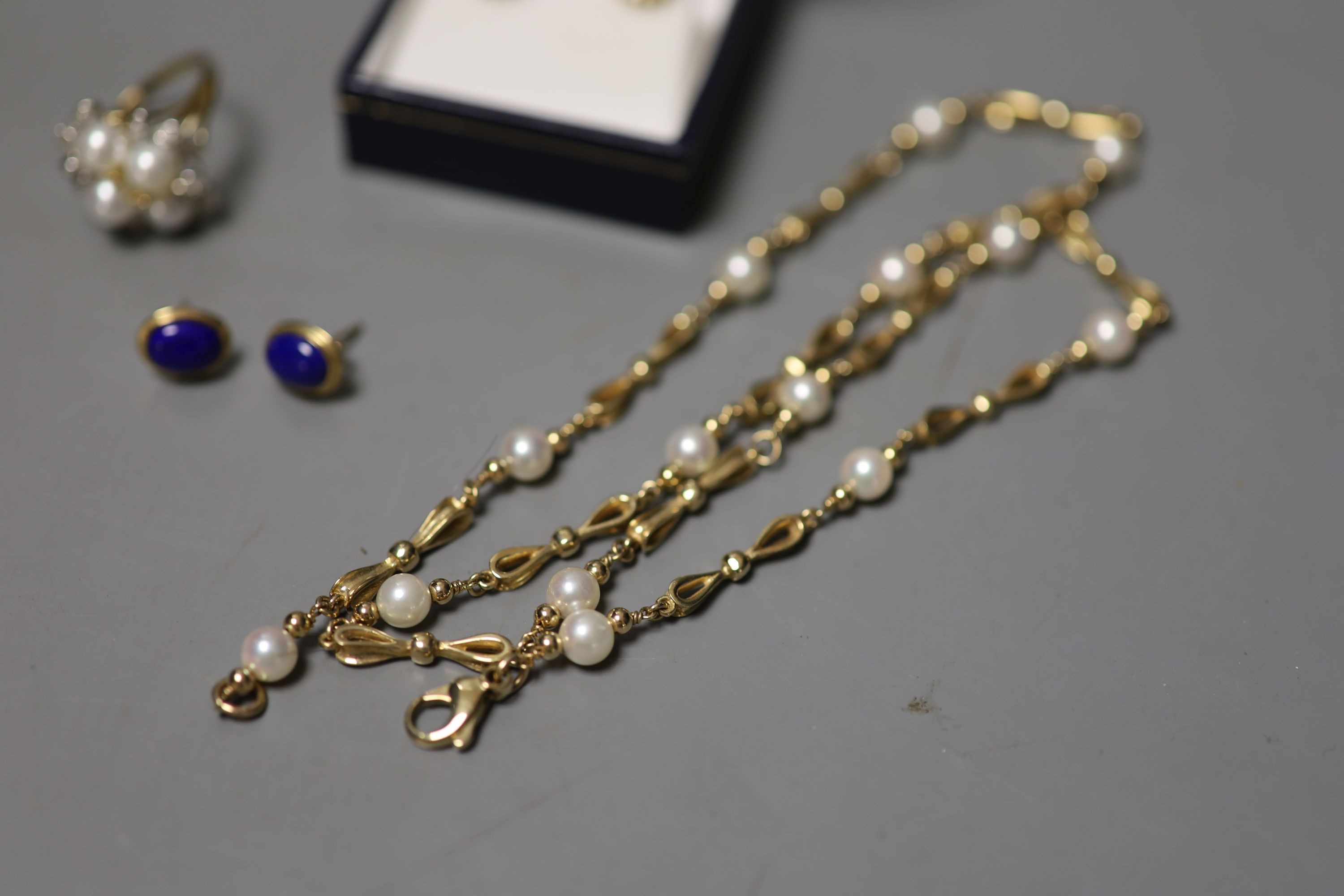 A pair of 9ct and lapis lazuli ear studs, a 9ct and cultured pearl necklace, gross 18.9 grams, a pair of 750, sapphire and diamond set oval ear studs, a 9ct dress rings and a quantity of assorted costume jewellery.